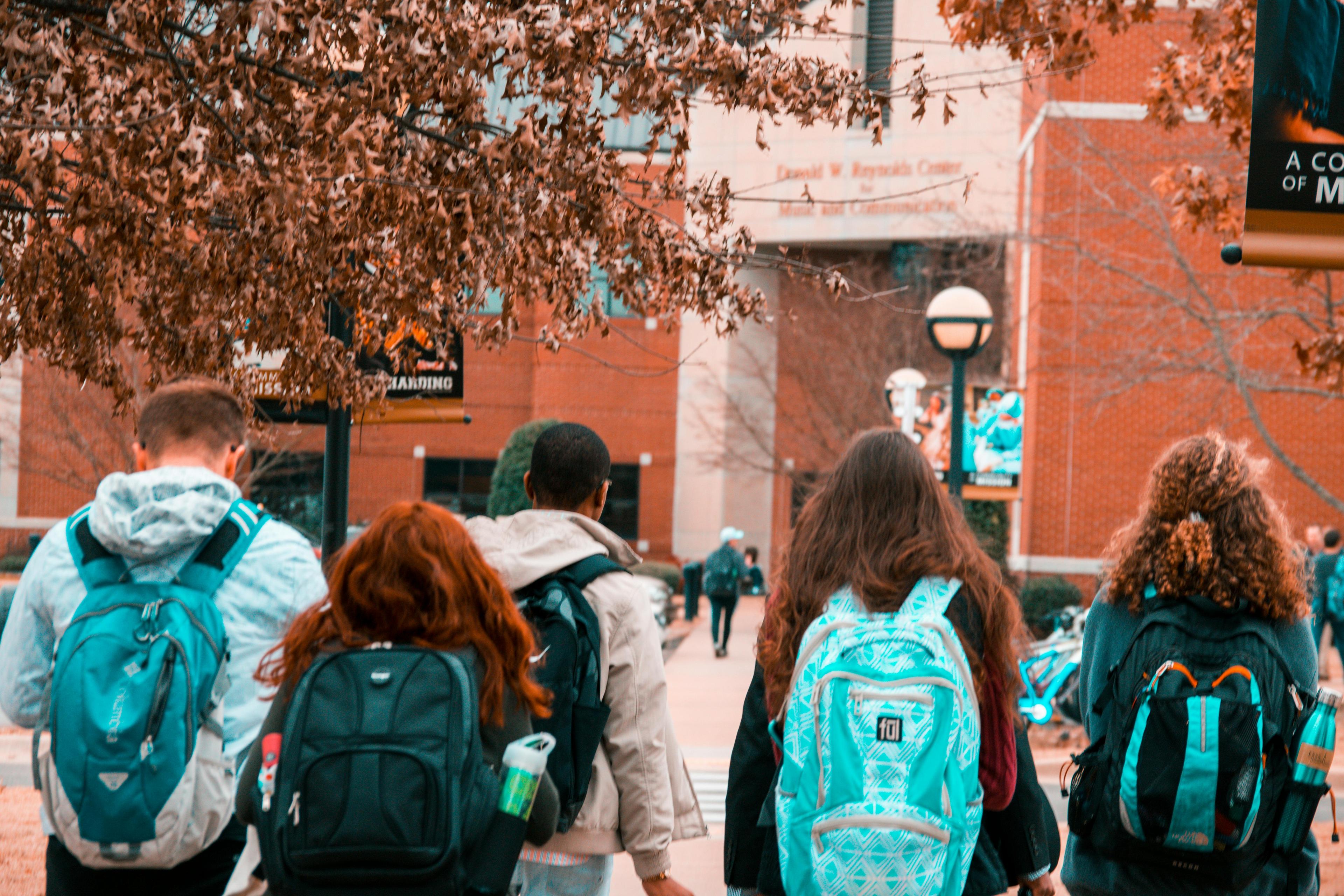 College students studying together in a modern campus building with natural lighting